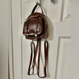 Leather zip front flop bag